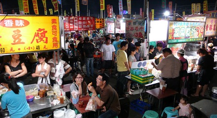 Crowded food stalls at Hua Yuan Night Market